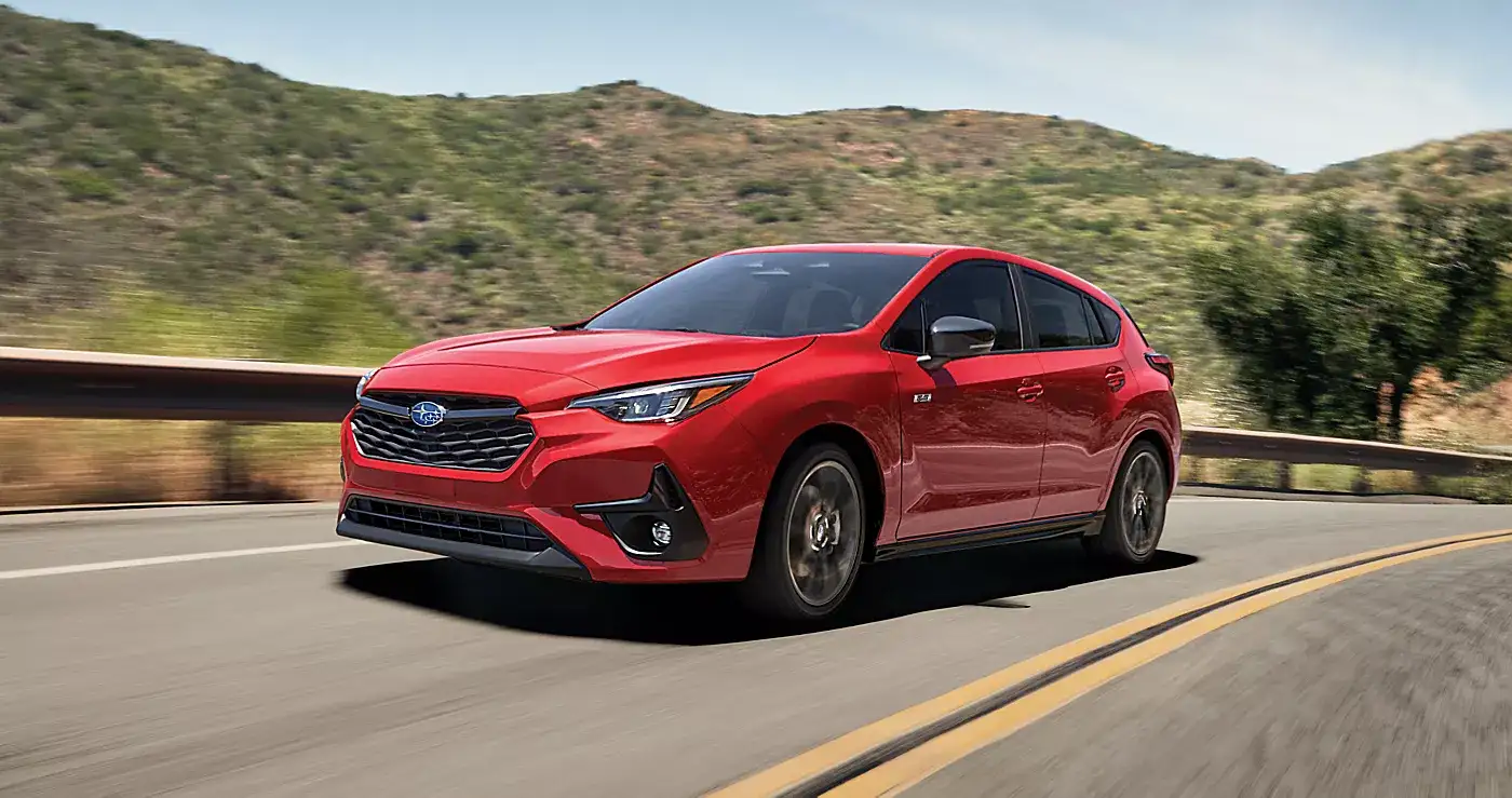 2026 Subaru Impreza Pure Red in motion