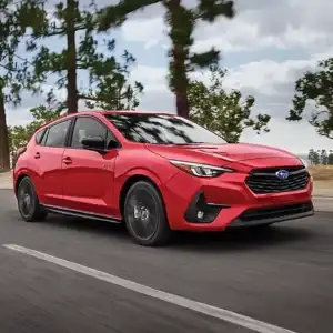 2026 Subaru Impreza RS Pure Red in motion