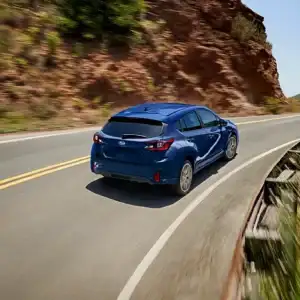 2026 Subaru Impreza Sport Sapphire Blue Pearl in motion