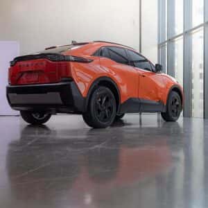 2026 Subaru Uncharted Habanero Orange Metallic rear and side view