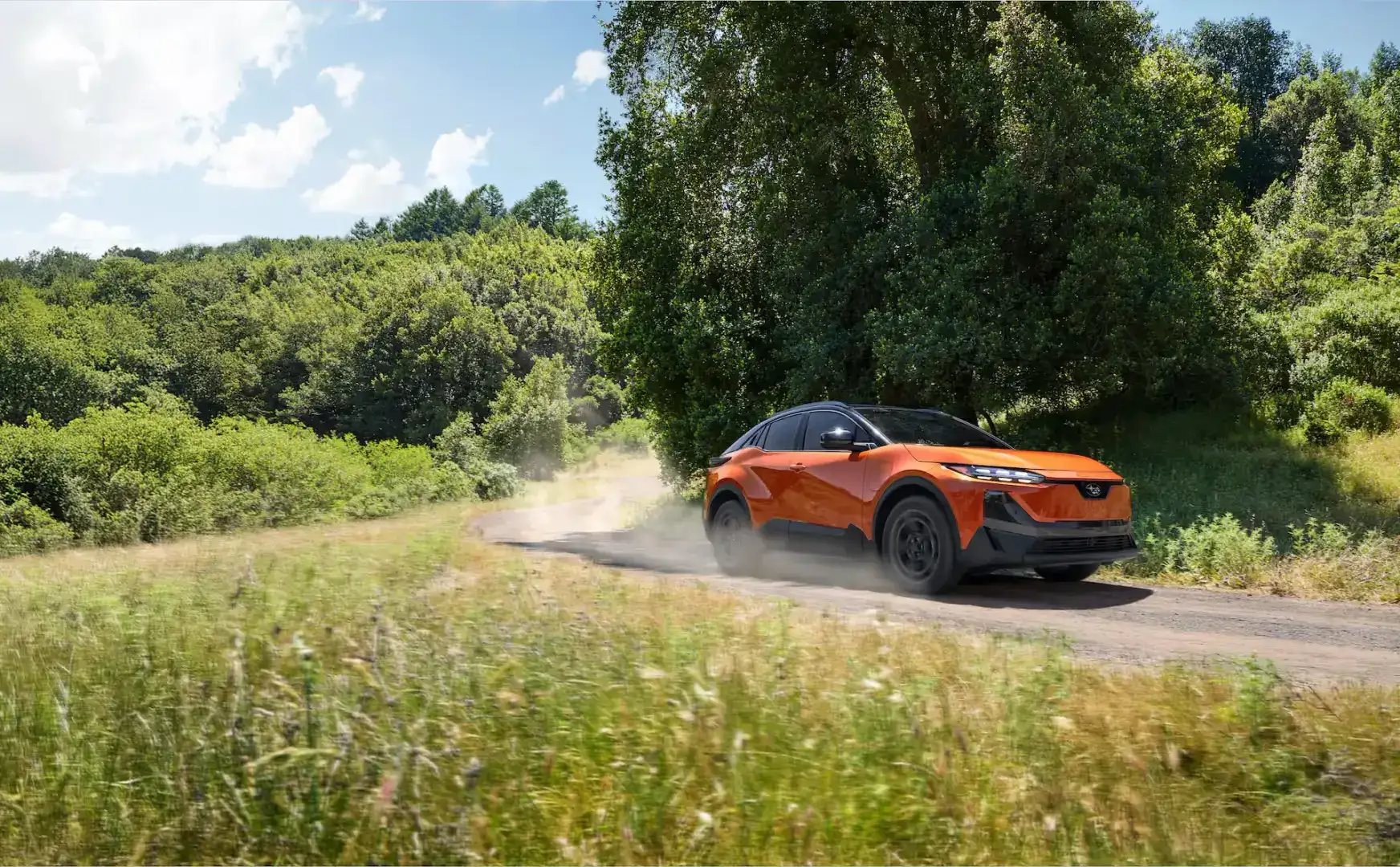 2026 Subaru Uncharted Habanero Orange Metallic in motion