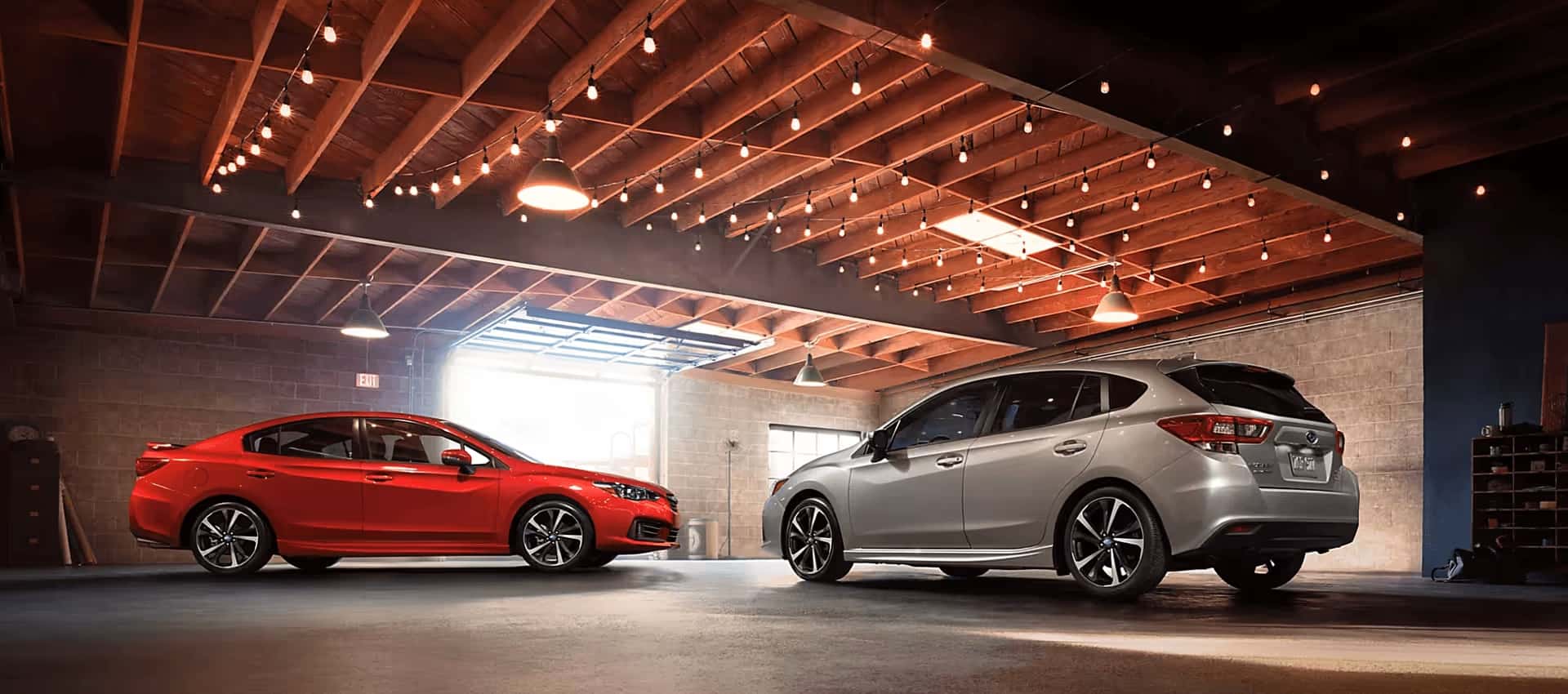 Two Off-Road Capable Models Of The Subaru Impreza, Parked In An Indoor Parking Space