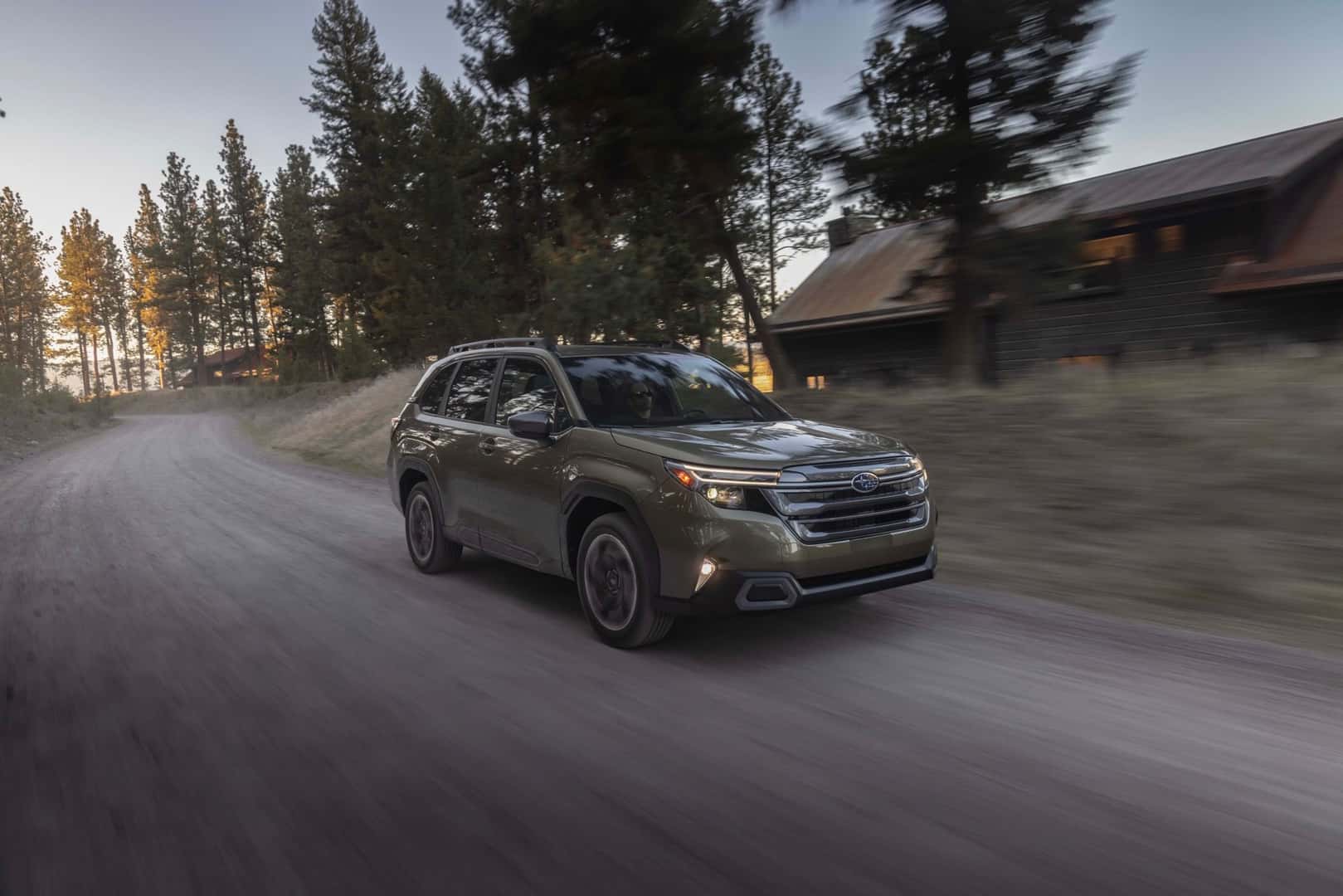 The Chill And Protective 2025 Subaru Forester Cruising Past Sparse Trees And Homes