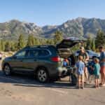 2026 Subaru Ascent loaded with outdoor gear on a Carson City lot with the Carson Range visible in the background