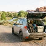 2026 Subaru Forester Wilderness rear hatch open on gravel road at Silver Saddle Ranch with hiking gear loaded, Carson City Nevada