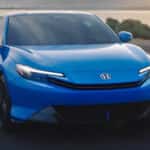 A blue Honda Prelude hybrid sports coupe on the road