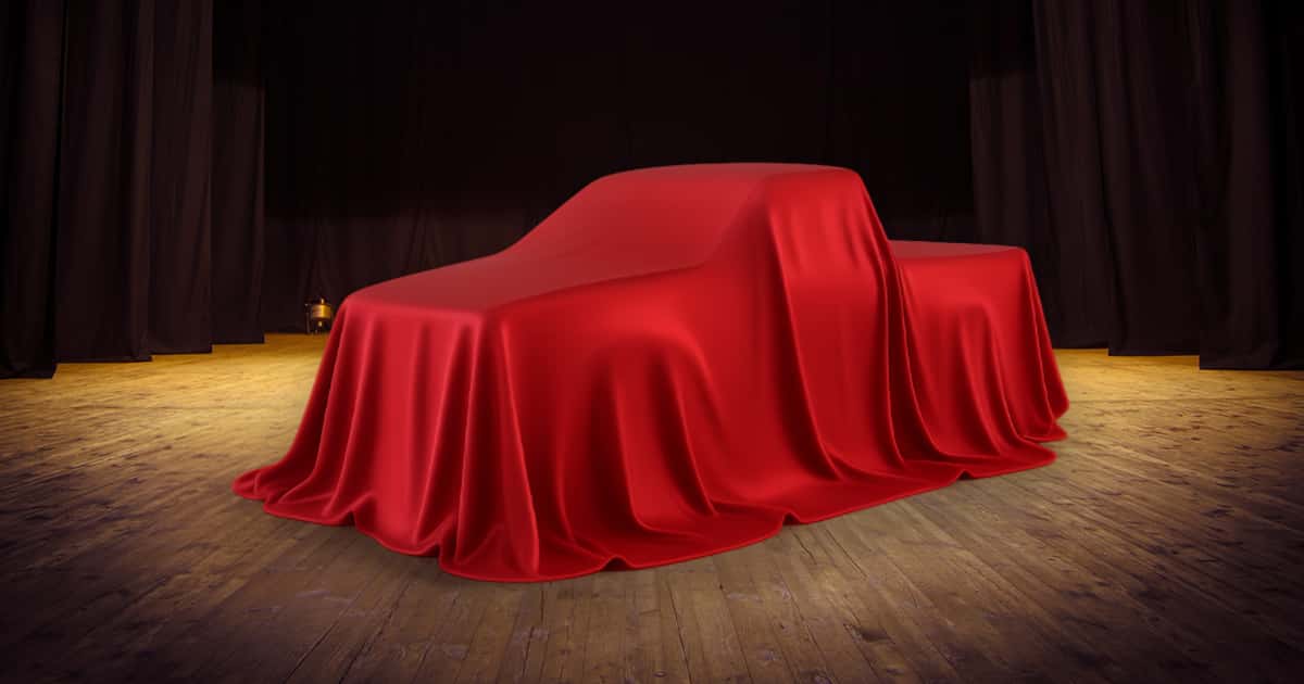A Toyota truck hidden under red covers