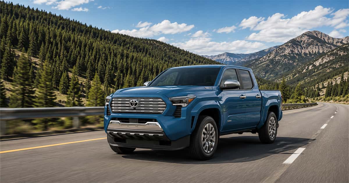 A Toyota Tacoma Limited pickup truck in Heritage Blue on a road.