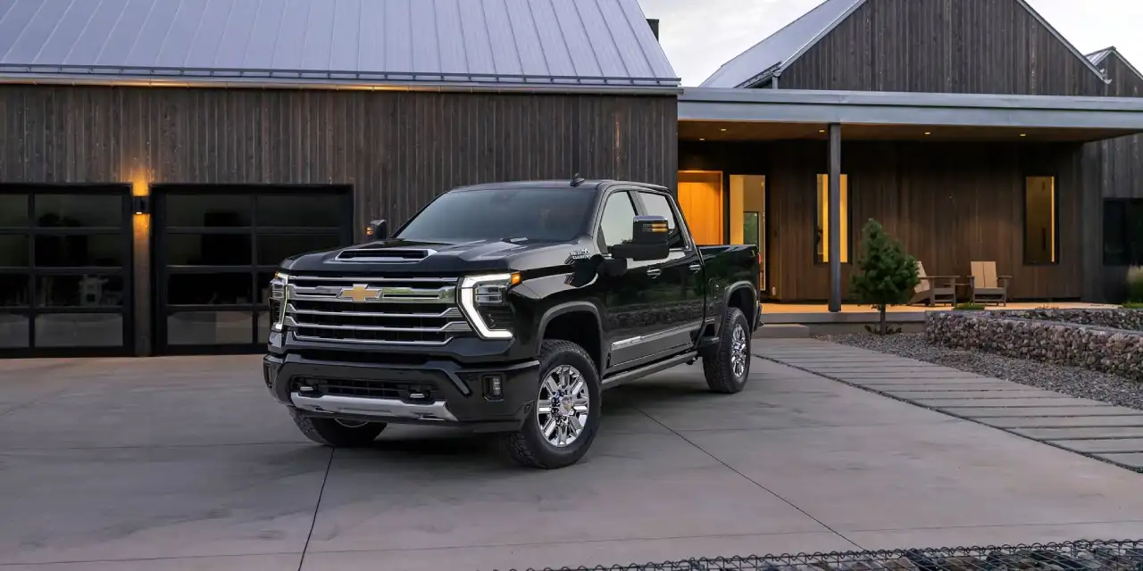 2026 Chevrolet Silverado HD exterior with towering grille and tow mirrors