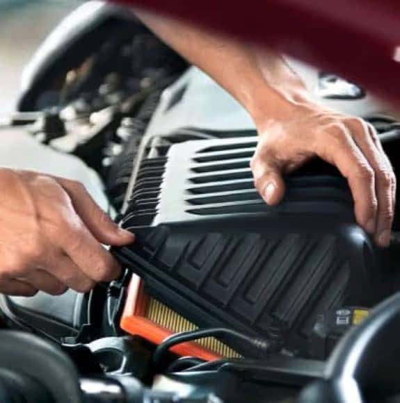 Technician replacing filter