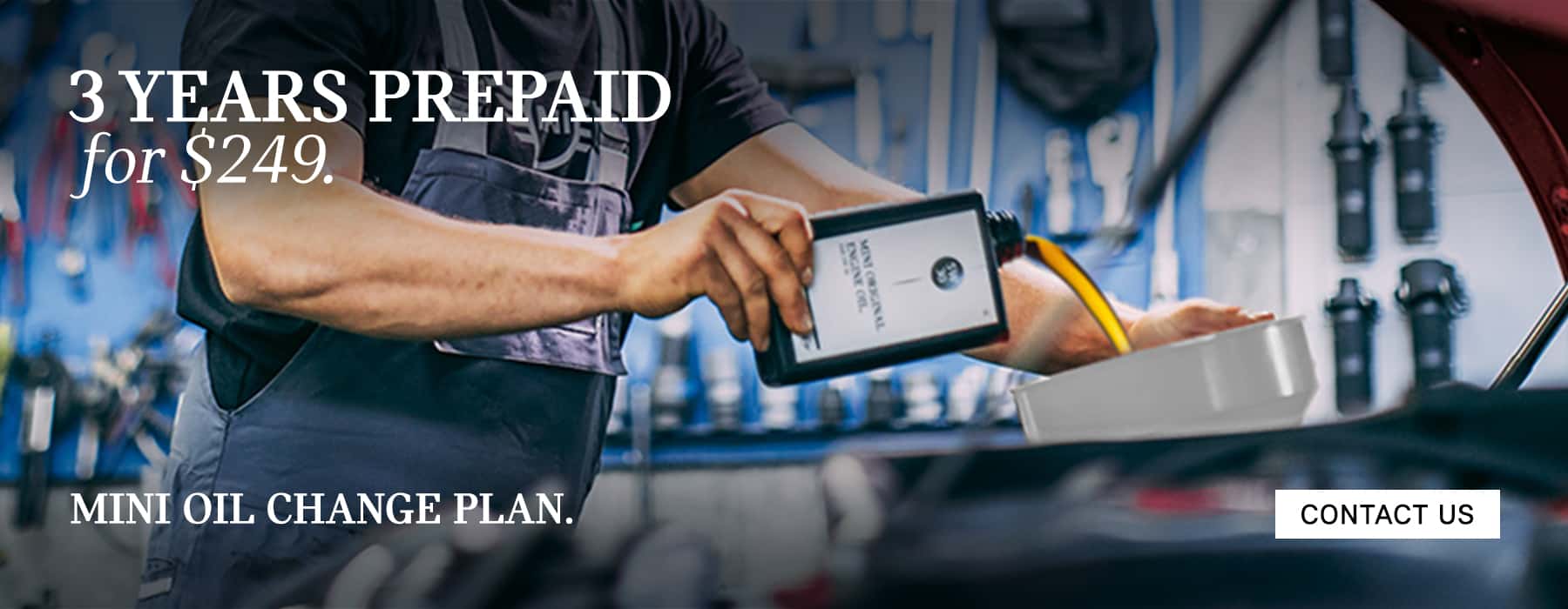 Service expert changing oil on a MINI.