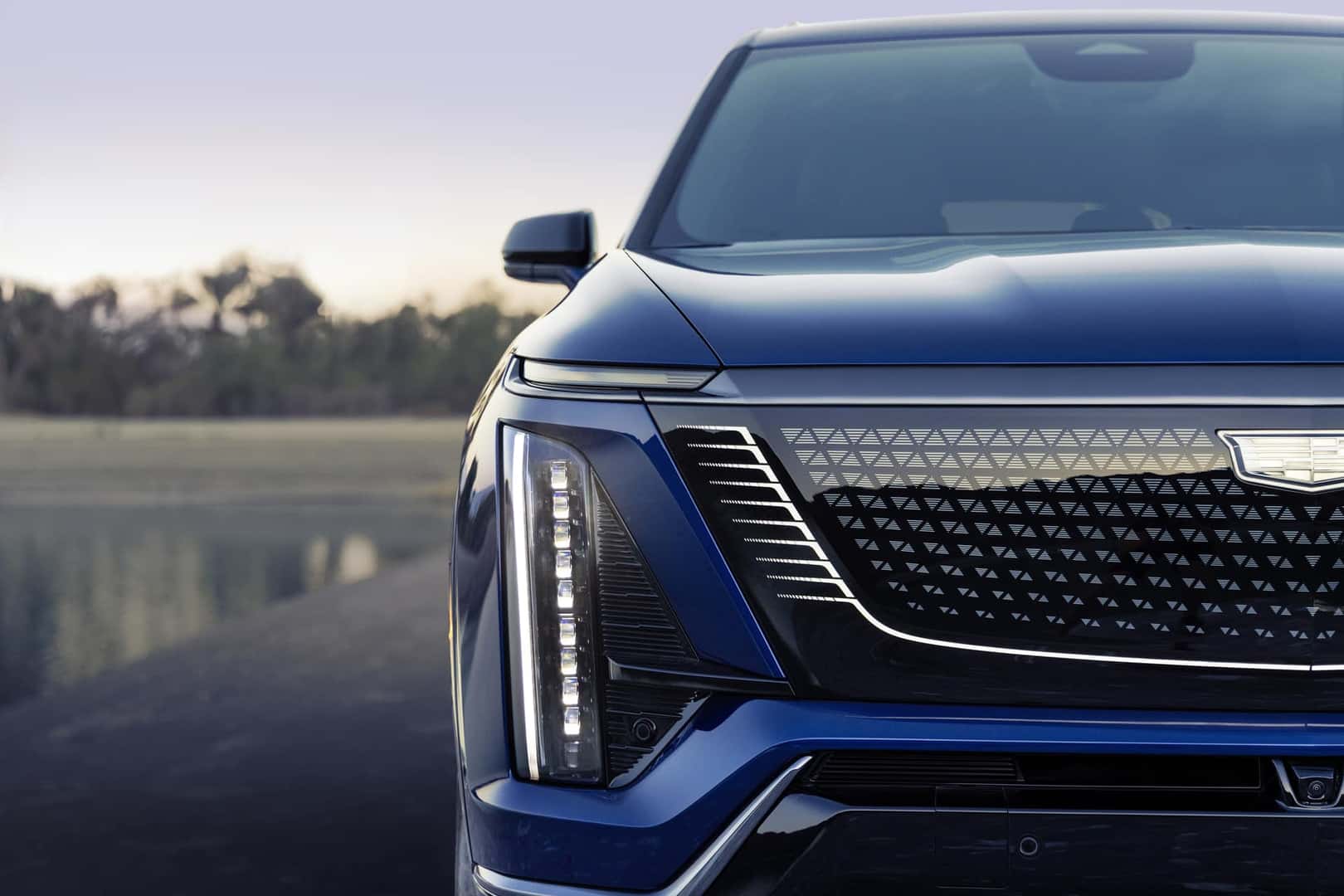 The 2026 Cadillac VISTIQ Black Crystal Shield grille in Opulent Blue.