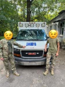 smiley people next to ambulance