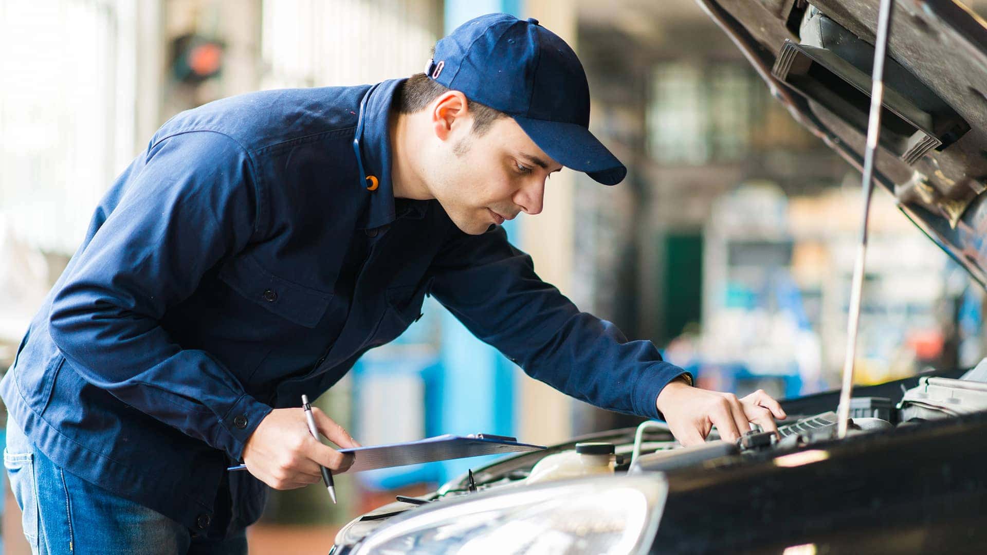 service technician working on vehicle