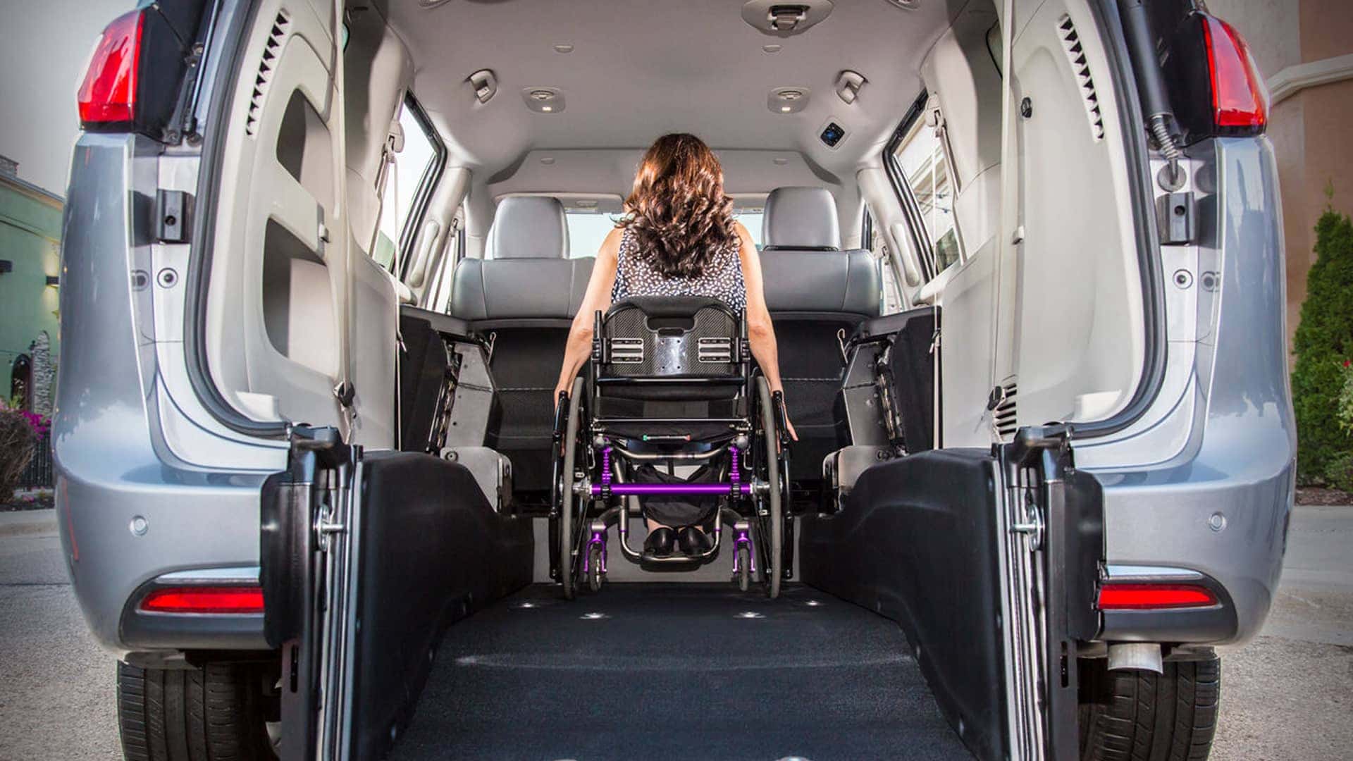 woman in wheelchair in back of accessible van