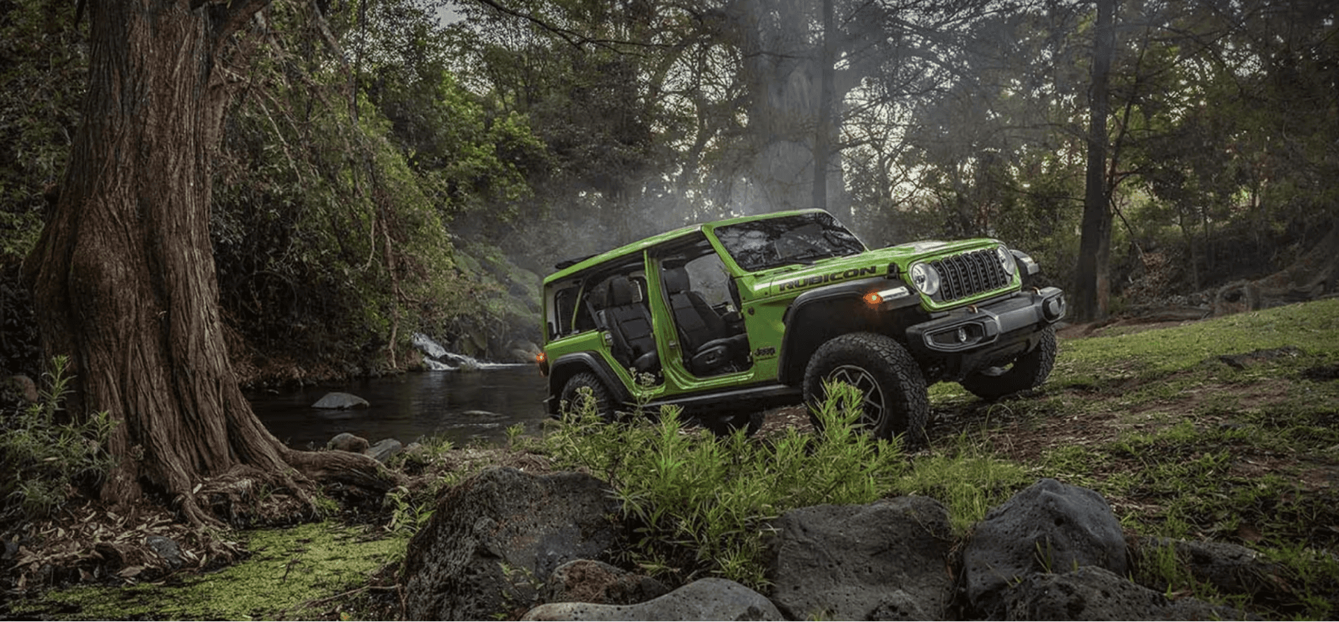 2026 Jeep Wrangler resting near a peaceful stream