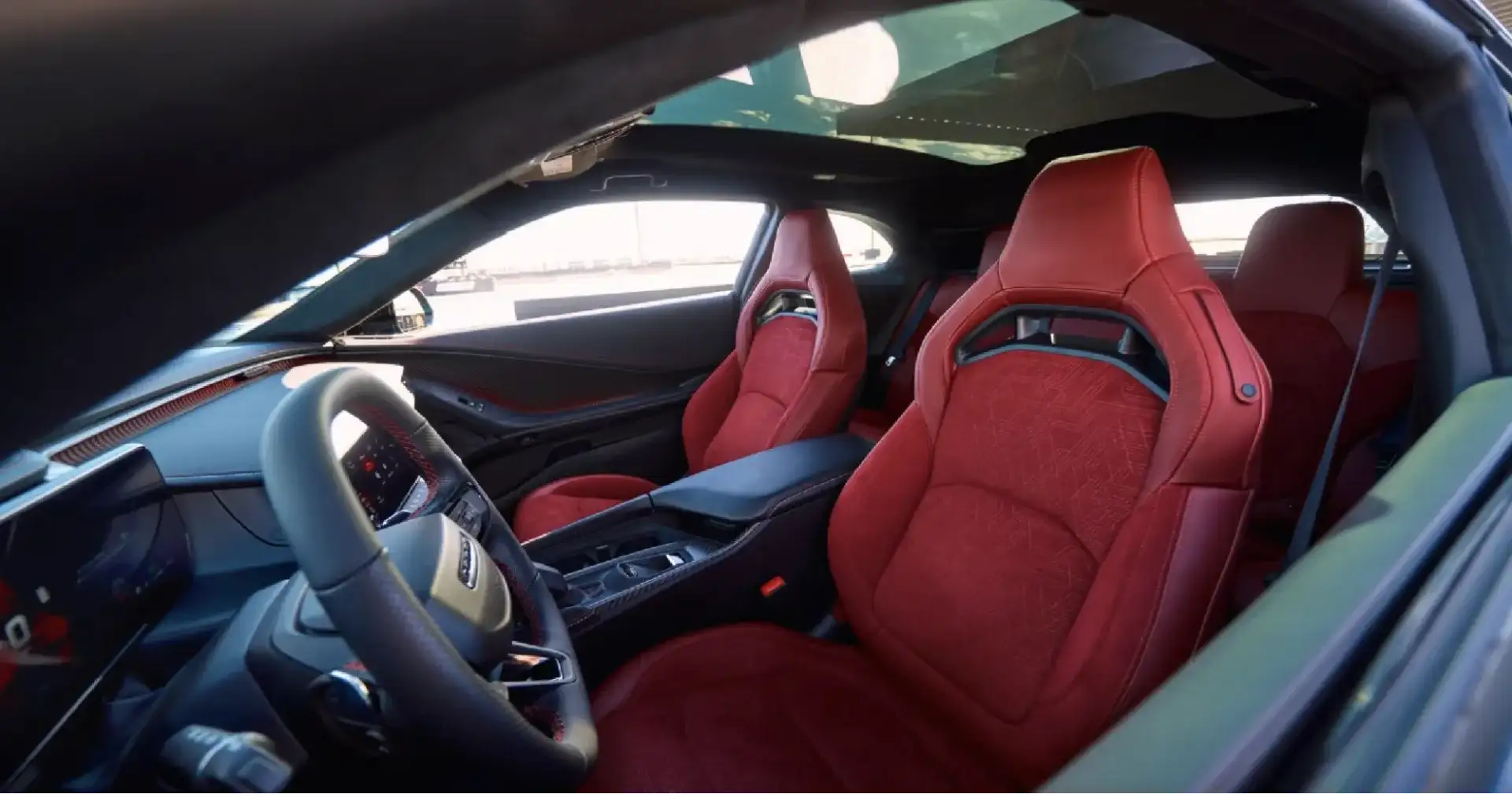 2026 Dodge Charger interior with red performance seats and panoramic roof