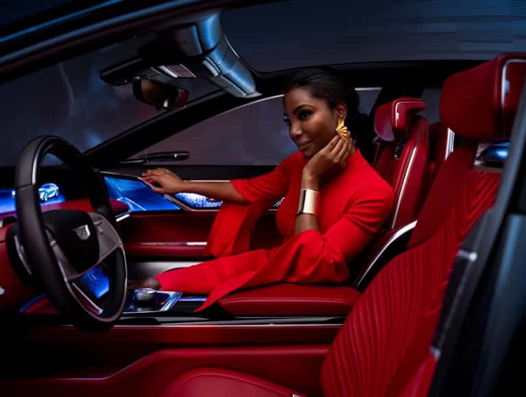 Woman sitting in a Cadillac