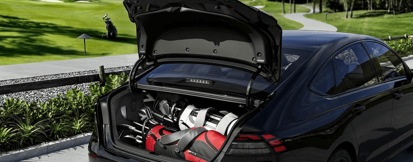 Driver loading the trunk of a 2026 Honda Accord