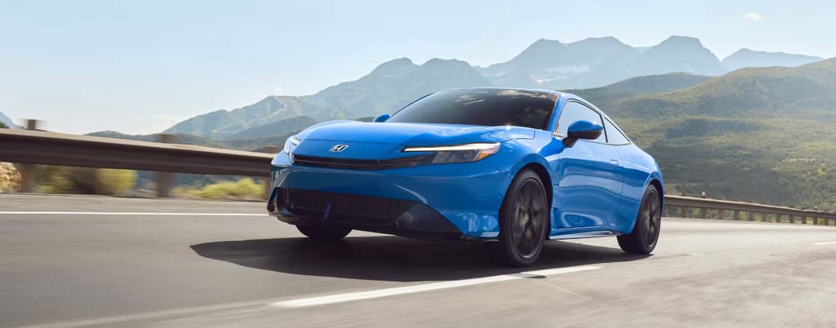 2026 Honda Prelude hybrid coupe on a winding road