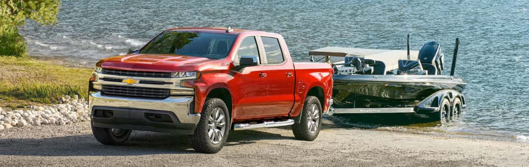 2026 Chevy Silverado towing a camper trailer