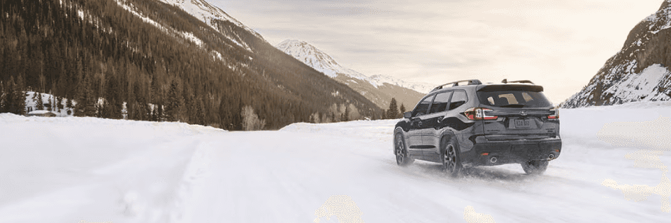 Subaru driving on a snowy road using X-MODE