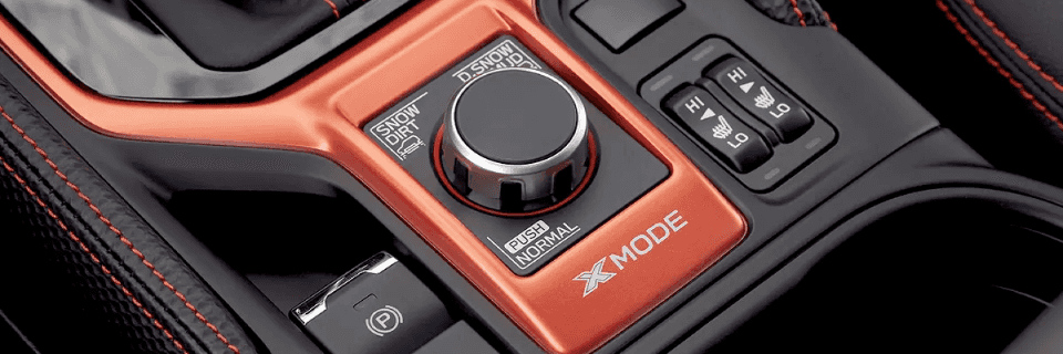 Close-up of Subaru X-MODE control knob and buttons