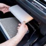 Car air filter in auto repair shop. Auto service industry. Automotive background