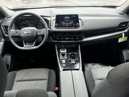 2025 Nissan Rogue interior view of front seating area and dash