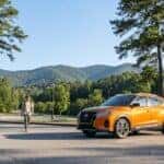 2026 Nissan Kicks parked on a north Georgia college campus lot near the Blue Ridge foothills
