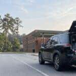 2026 Nissan Pathfinder with open liftgate loaded with back-to-school supplies at a Gwinnett County school drop-off lane