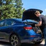 2026 Nissan Sentra parked in Gainesville, GA area with young adult loading trunk for daily commute