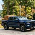 2026 Nissan Frontier loaded with pine straw bales in a Flowery Branch, GA driveway during fall landscaping season