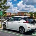 2026 Nissan LEAF charging at a DC fast charging station in Buford, Georgia on a sunny summer day