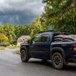 2026 Nissan Frontier with loaded bed of mulch bags and lumber on a north Georgia residential street hauling-hall-county-gainesville-2026-nissan-frontier-premier-nissan-mall-of-georgia