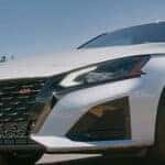 Nissan Altima driving efficiently on Vero Beach roads to maximize fuel economy