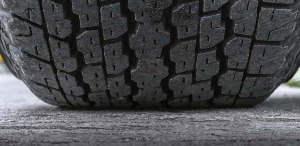 Tire tread depth inspection to improve traction during rainy season in Vero Beach FL