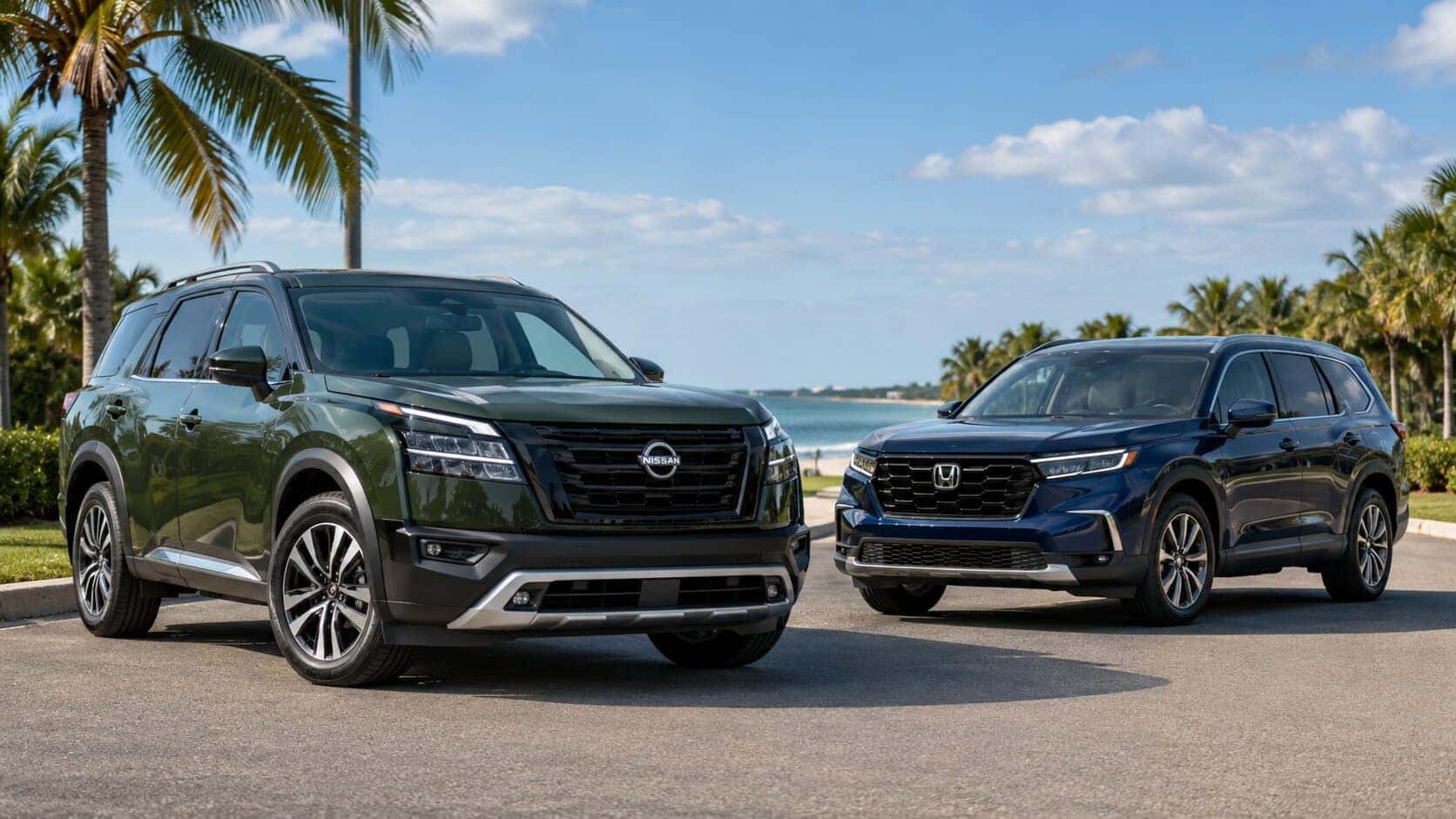 2026 Nissan Pathfinder parked next to Honda Pilot with palm trees in the background