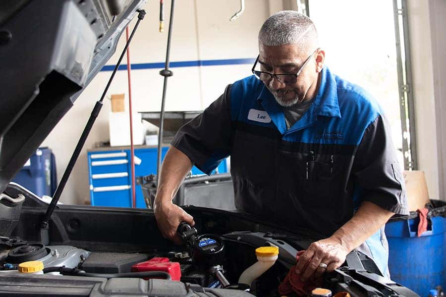 man performing an oil change