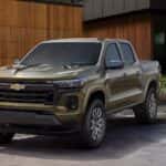 A green 2025 Chevy Silverado 1500 Z71 parked n a driveway.