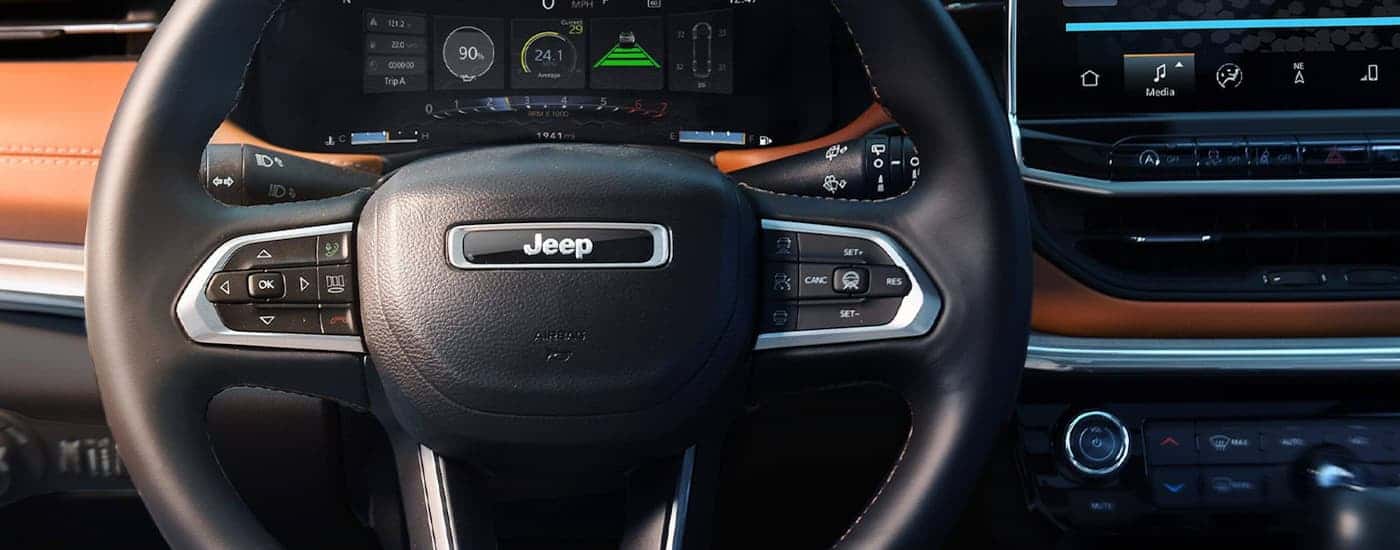 Close-up of the steering wheel on a 2025 Jeep Compass at a Jeep Dealer Near Hondo
