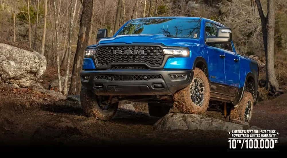 A blue 2026 Ram 1500 parked off-road.