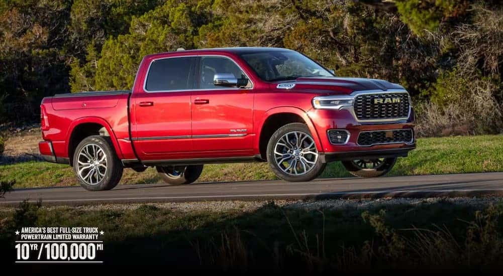 A red 2026 Ram 1500 parked on a road.