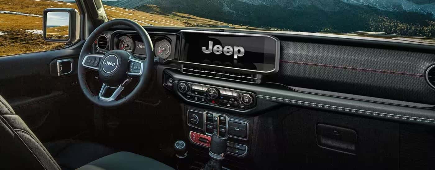 Infotainment and digital gauge cluster on a 2024 Jeep Wrangler for sale