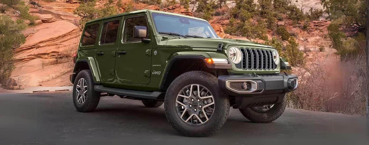 A green 2025 Jeep Wrangler Sahara Unlimited parked