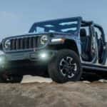A blue 2026 Jeep Gladiator parked on a hill.