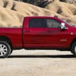 A red 2026 Ram 2500 for sale parked off-road.