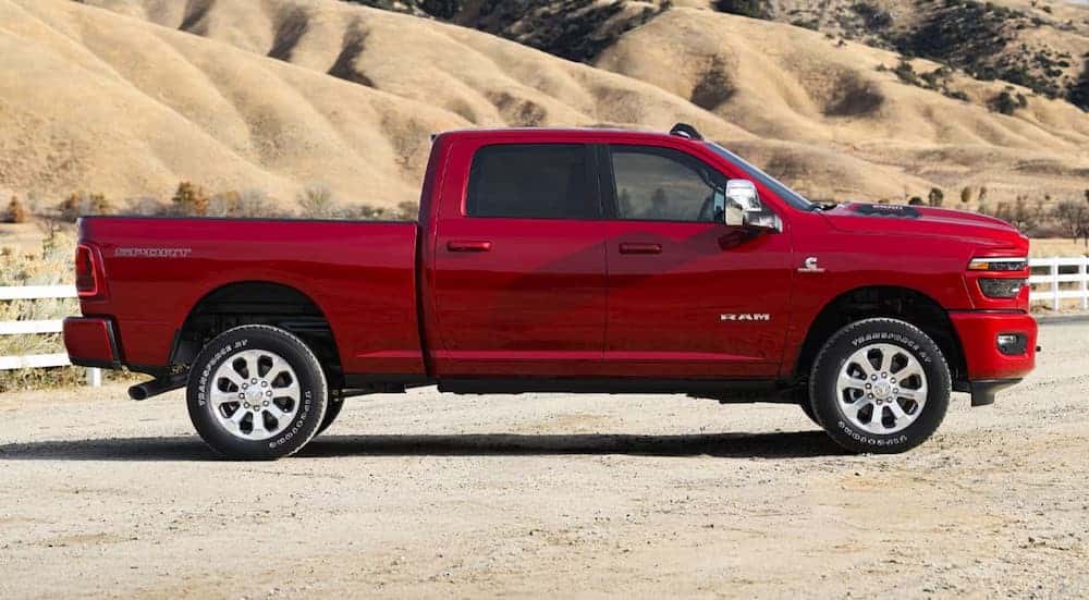 A red 2026 Ram 2500 for sale parked off-road.