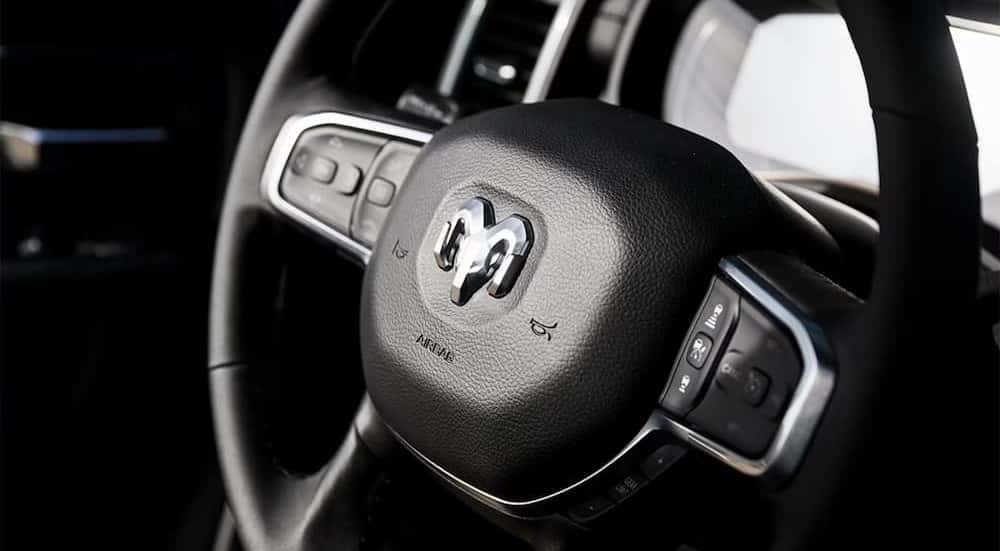 Close-up of the steering wheel in a 2026 Ram 2500.