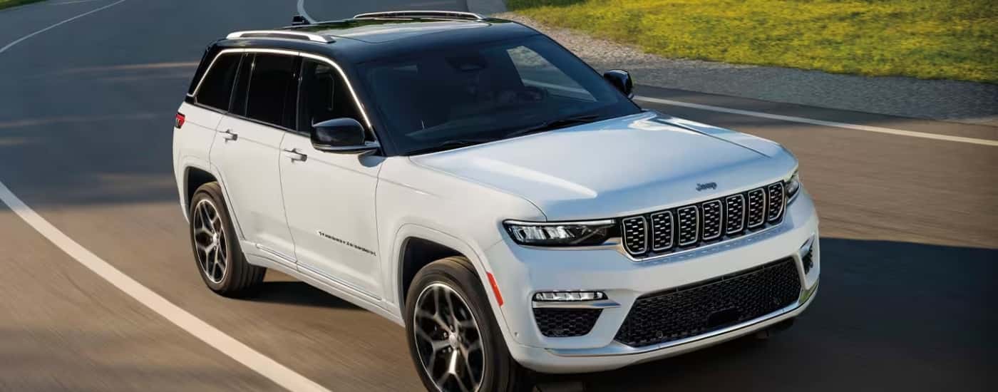 A white 2025 Jeep Cherokee from the front at an angle.